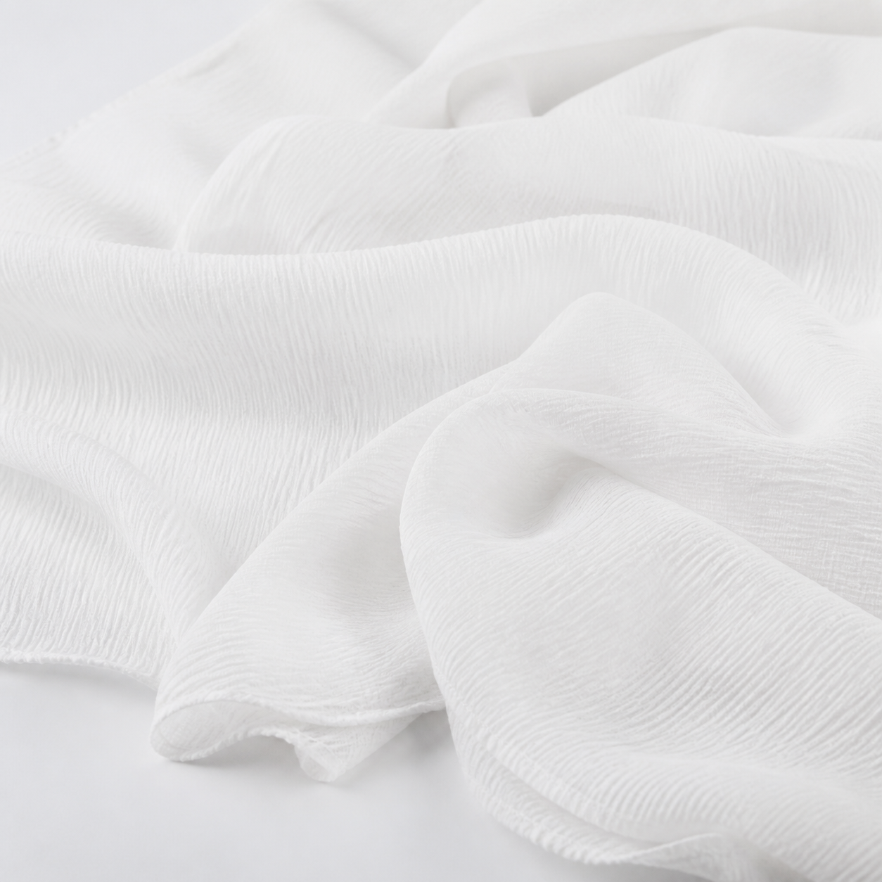 Saad Salman | Silk Fabric Manufacturer & Wholesaler White crinkle chiffon fabric in softly rippled studio folds