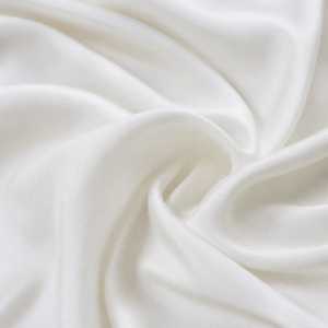 White spun silk fabric in smooth studio folds