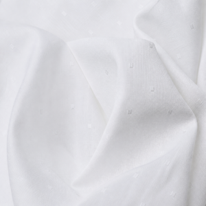 White self-pattern fabric with subtle tonal dots in studio folds